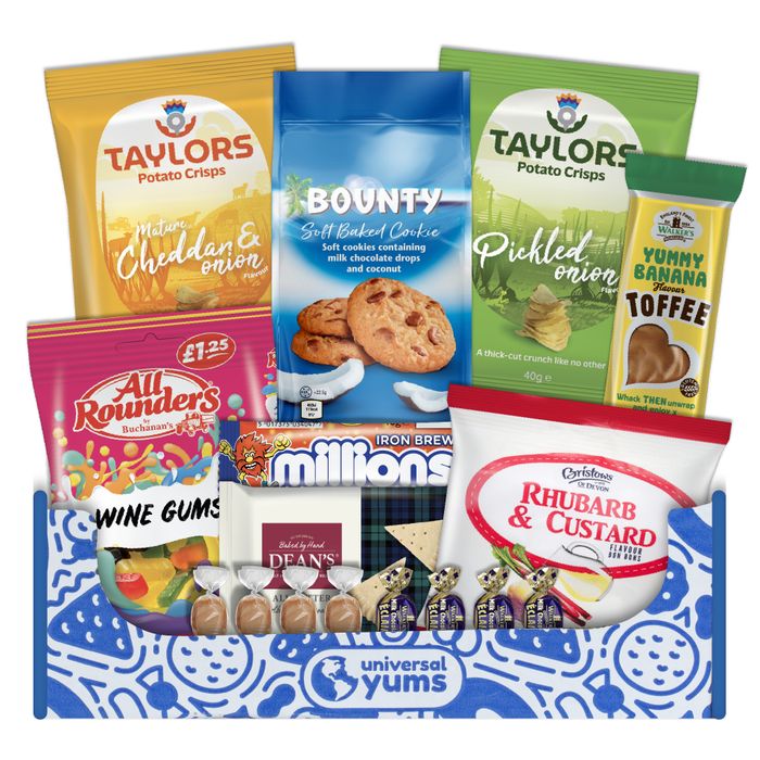 A colorful Universal Yums box filled with a variety of snacks, including potato chips, soft-baked cookies, toffee, and more.