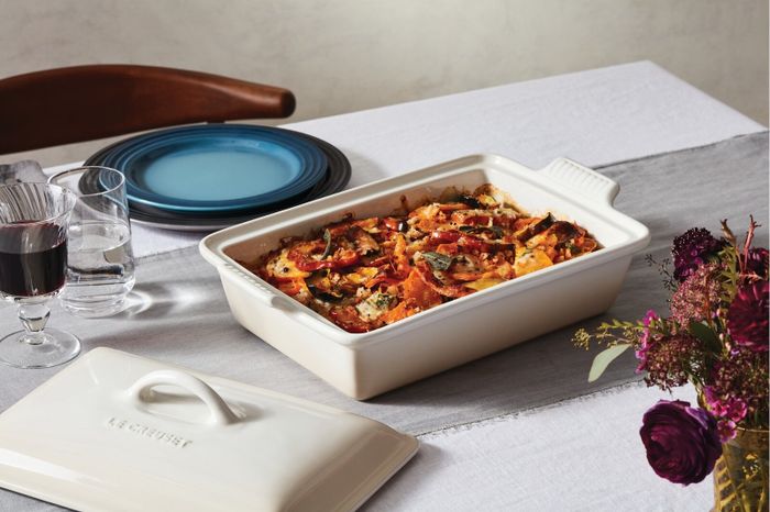 A casserole dish filled with food on a table.