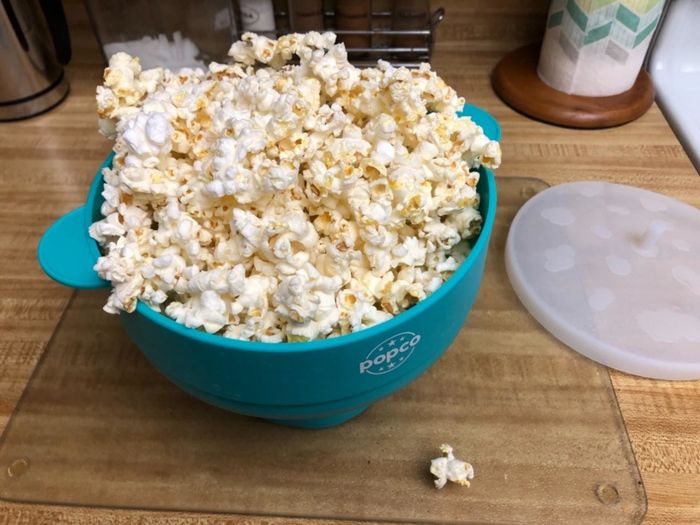 Review image of the popcorn popper filled with freshly popped corn