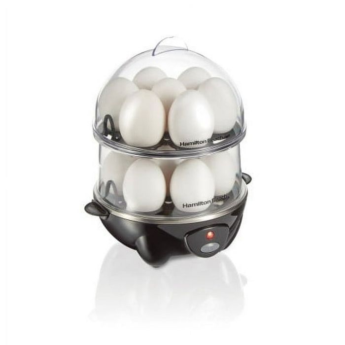 An egg cooker packed with eggs, showcasing a double-layer design and a compact base; perfect for fast and efficient egg steaming and cooking
