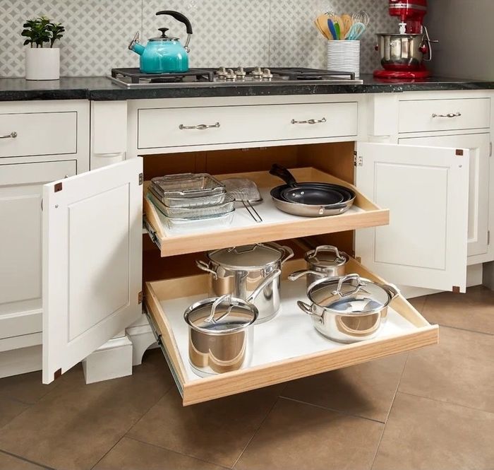 The slide-out shelves neatly organizing pots and pans