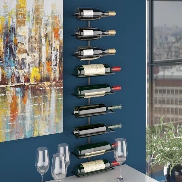 The wine rack mounted on the wall with bottles neatly arranged