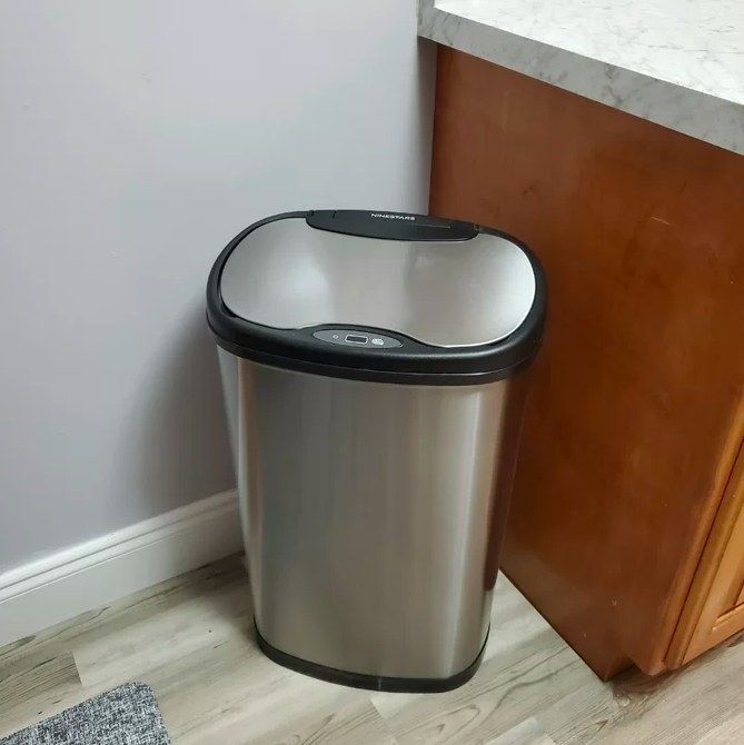 The trash can placed in a kitchen setting