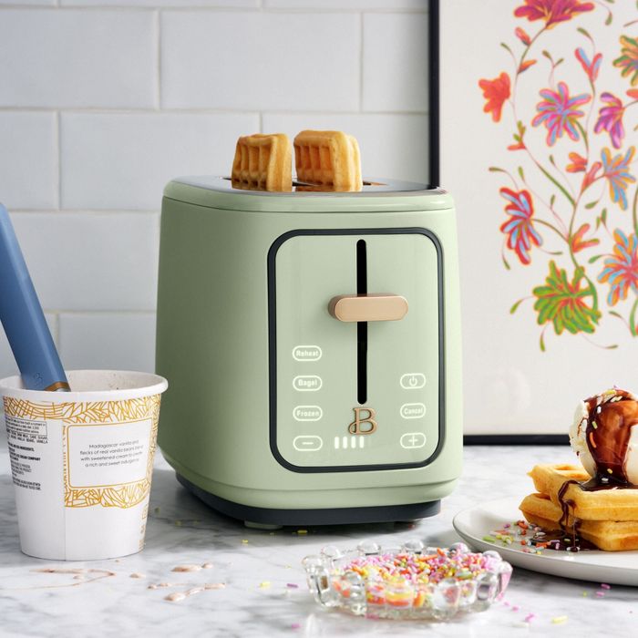 A touchscreen toaster toasting two waffles