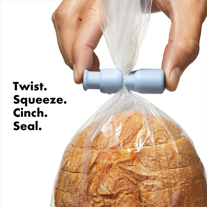 A loaf of bread sealed with the blue cinching closure.