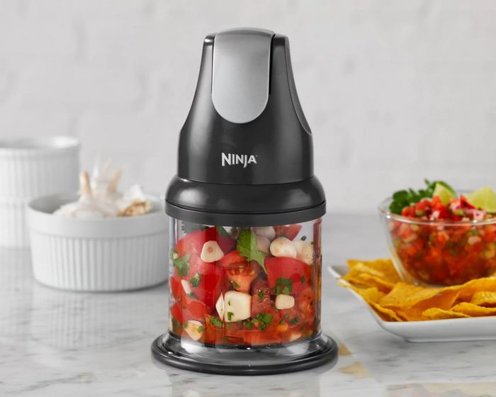 The food chopper preparing salsa in a kitchen