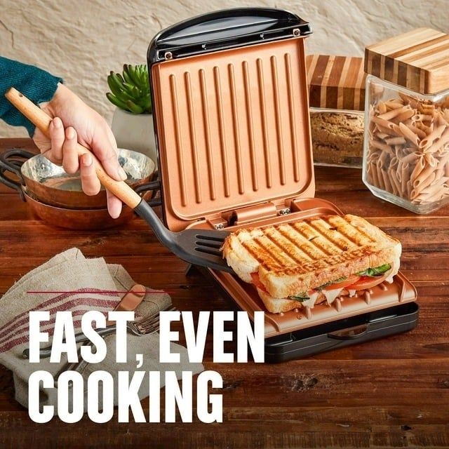 the George Foreman grill preparing a sandwich