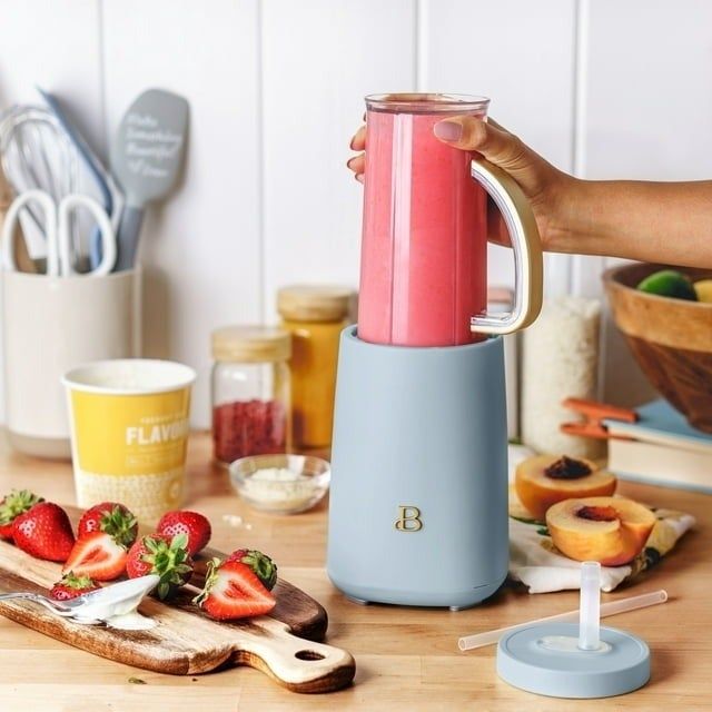 a blue blender filled with a freshly made smoothie