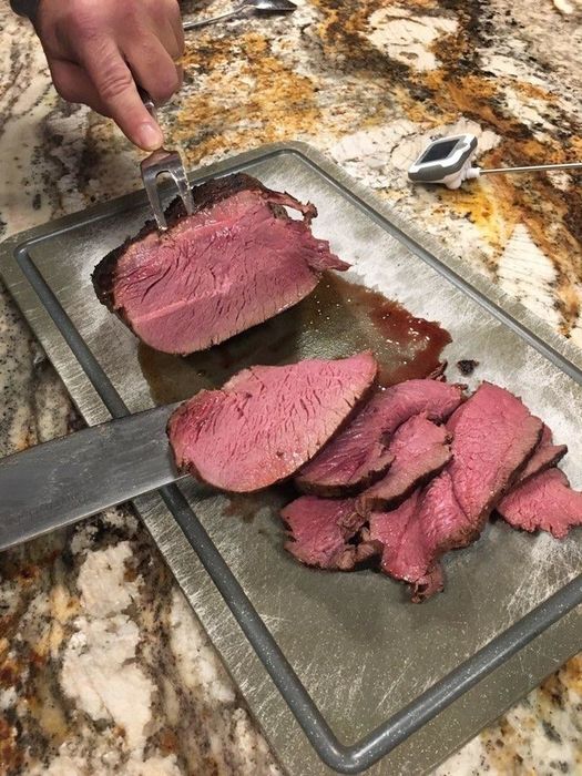 a reviewer showcases a perfectly cooked meal prepared using the sous vide device