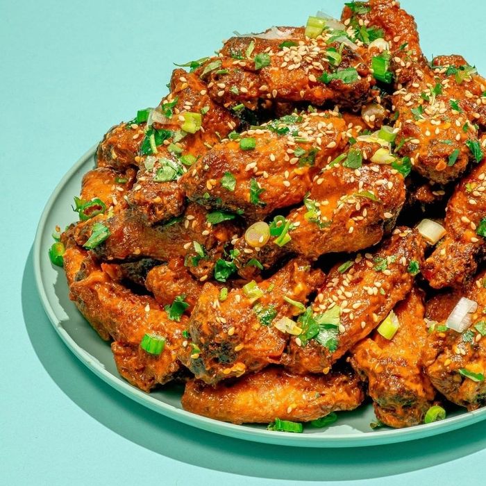 A plate filled with crispy, golden chicken wings.