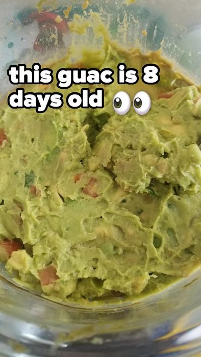 A bowl of guacamole with a text overlay saying “this guac is 8 days old” and an eye emoji.