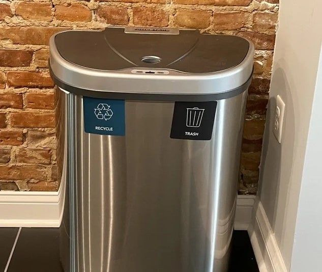 A reviewer’s photo showcasing the sleek trash can in use