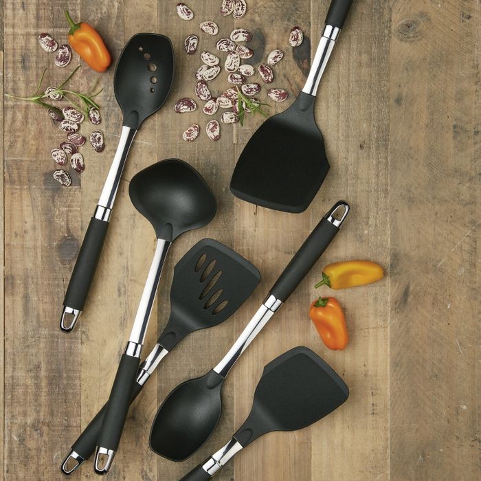 The utensil set displayed on a cutting board.