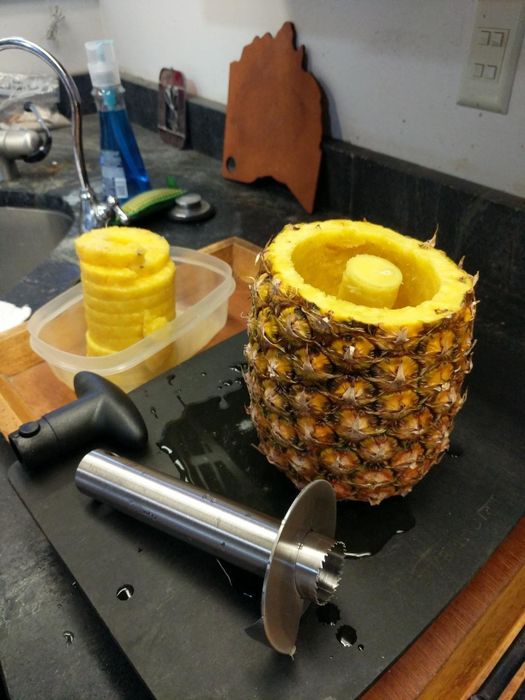 A photo from a reviewer showing their spiralized pineapple and the empty pineapple shell.