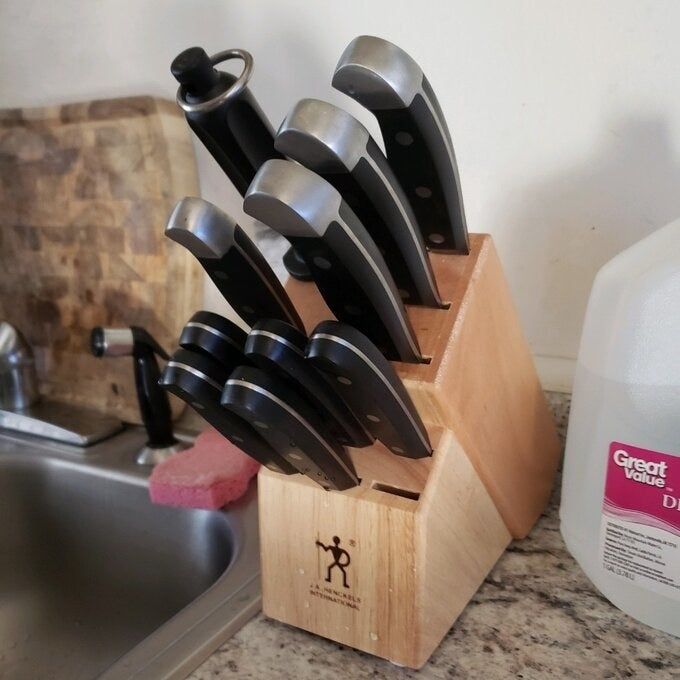 wooden block featuring a set of knives