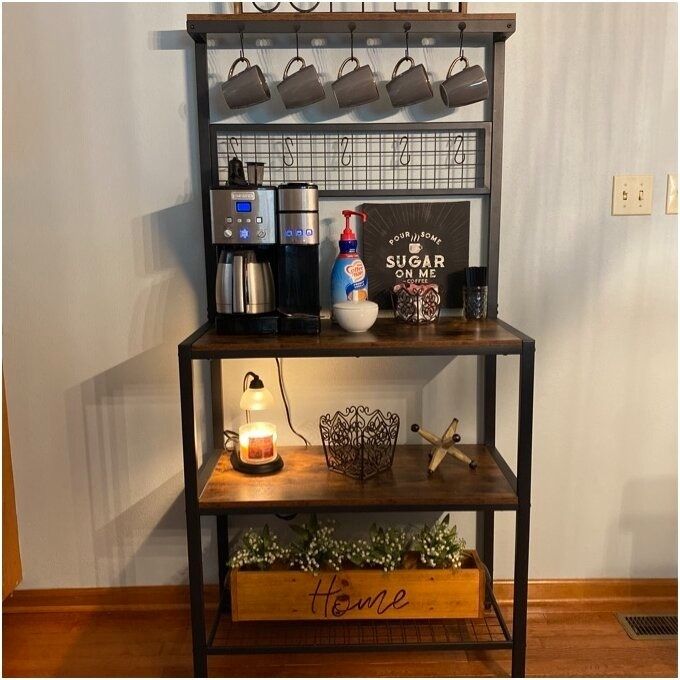 A cozy coffee station featuring a coffee machine, mugs, and decorative items with the phrase 