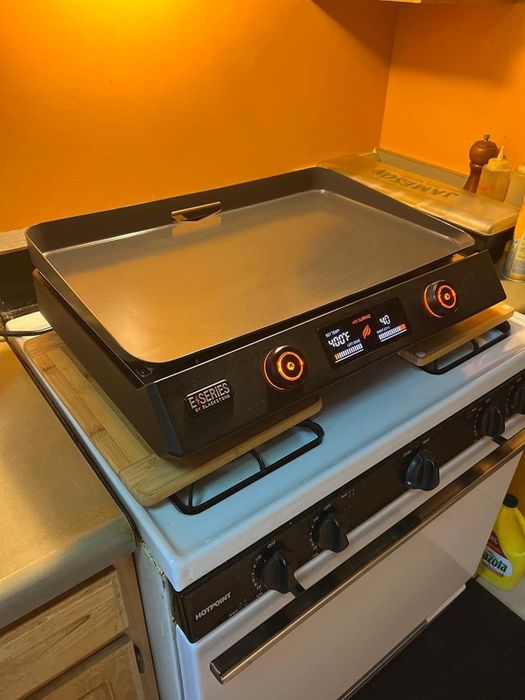The griddle placed on top of a stove