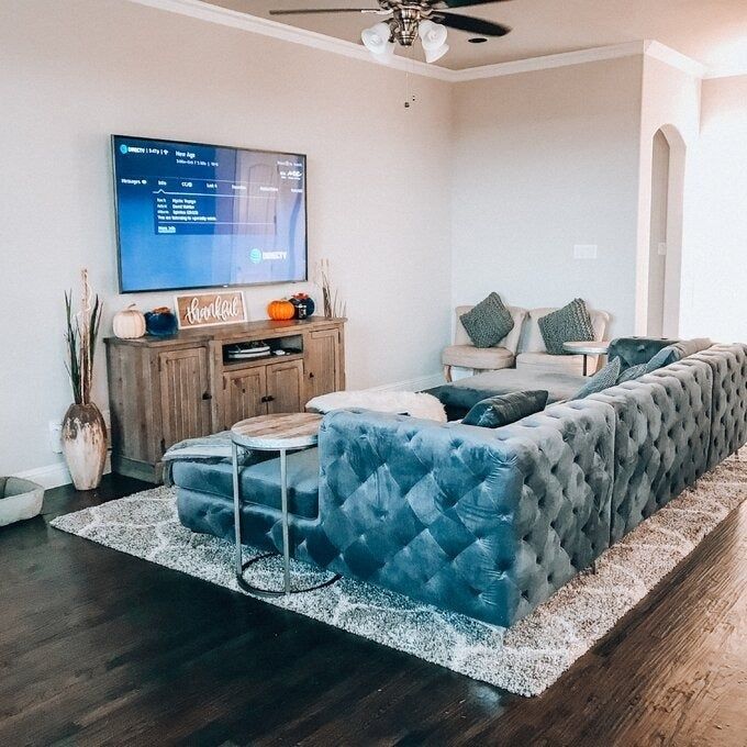 a customer photo showing the back of the gray sofa