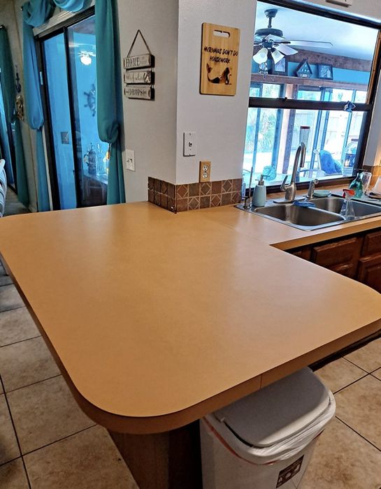 The reviewer shares a photo of their brown countertop.