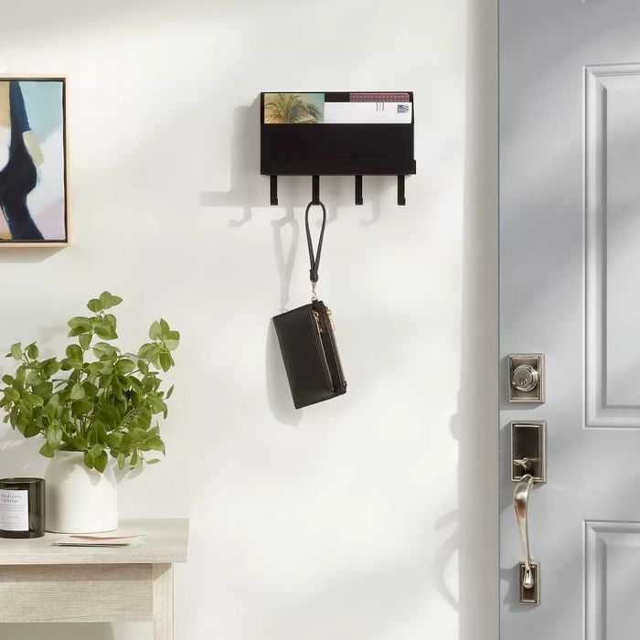 A wall-mounted file folder hanging in an office space, providing an easy and organized way to manage paperwork.