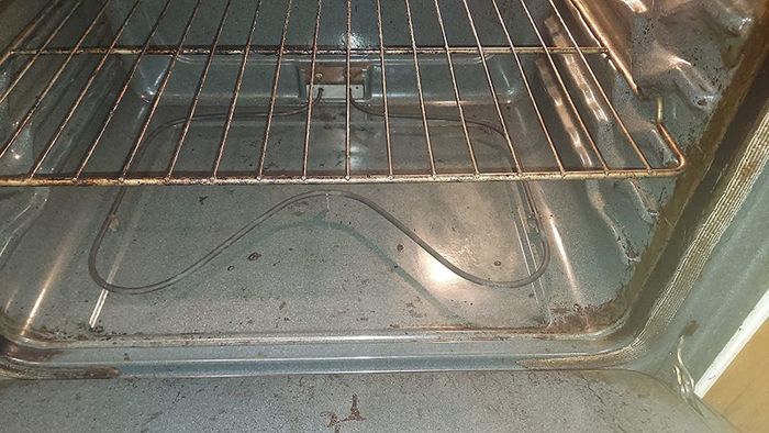 After photo of the oven, now nearly spotless and restored to its original grey color after using Goo Gone