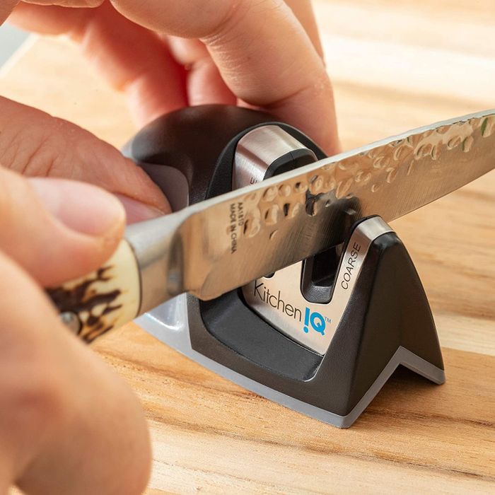 hand demonstrating the use of the sharpener