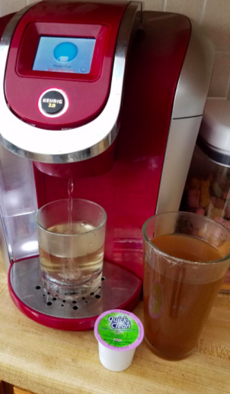 Reviewer photo showing the dirty liquid coming out of their Keurig while using a Quick & Clean cleaning pod.
