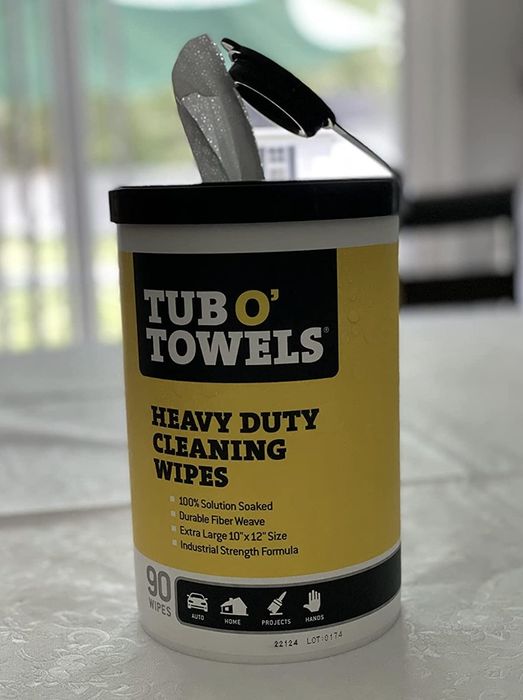 Reviewer photo showing the Tub O' Towels in its black and yellow packaging.