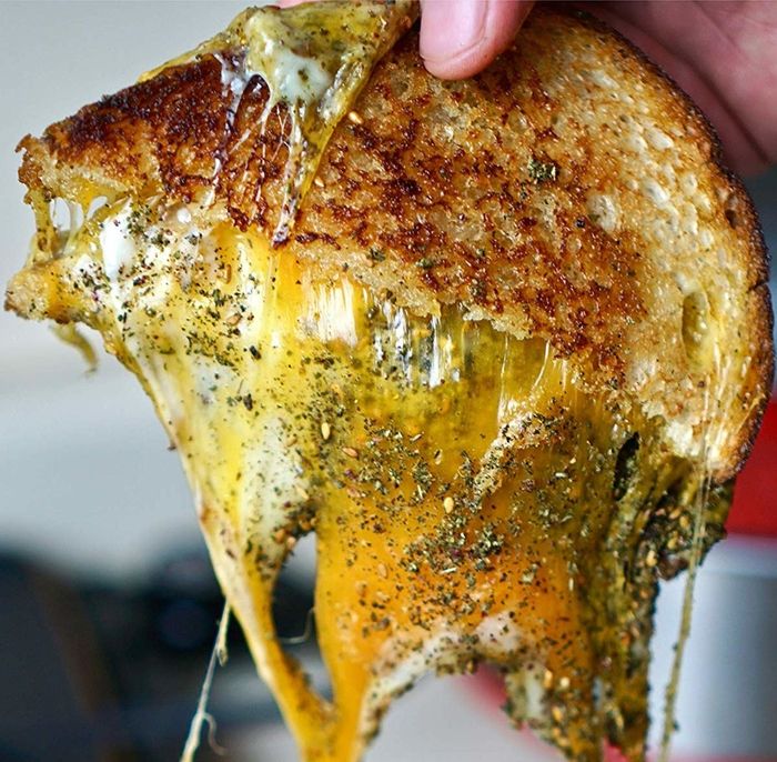 Photo of a grilled cheese sandwich topped with za'atar.