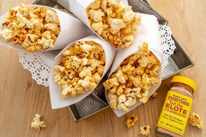 Seasoning sprinkled over popcorn