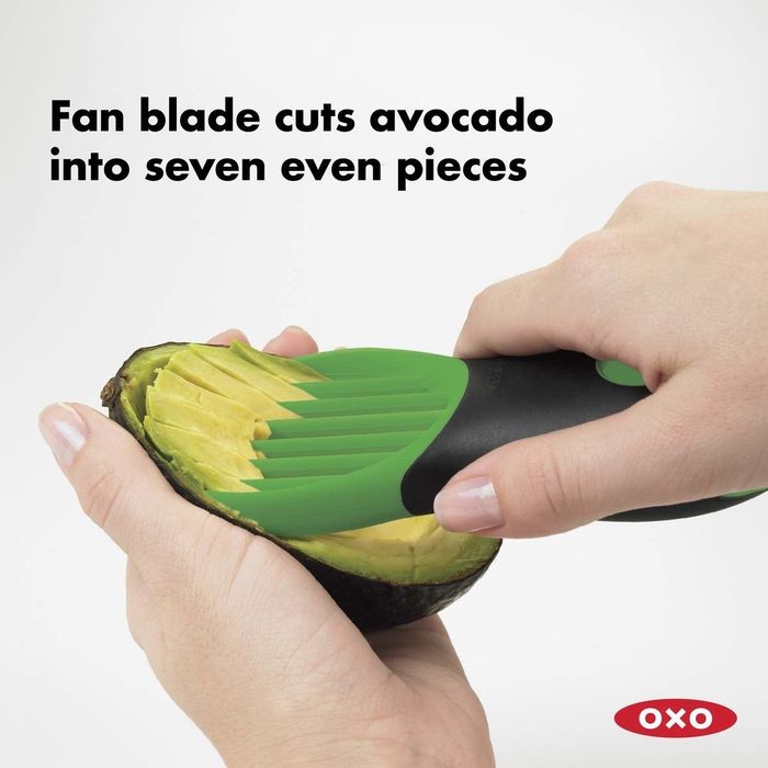 The tool slicing an avocado, with text on the image reading, 'Fan blade cuts avocado into seven even pieces.'