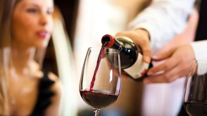 The server keeps topping off your wine glass