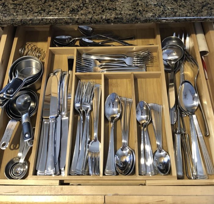 Reviewer photo showing their silverware neatly arranged in the bamboo utensil organizer within the drawer.