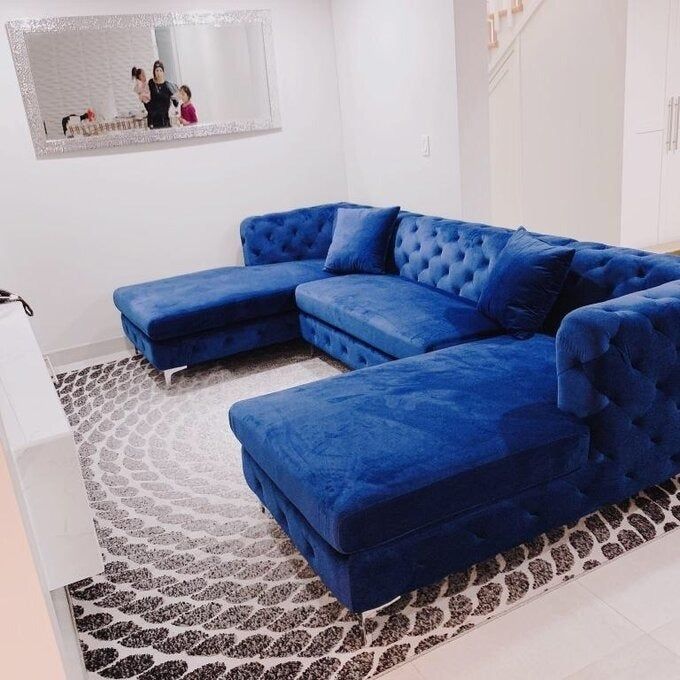 a customer photo of the royal blue sofa