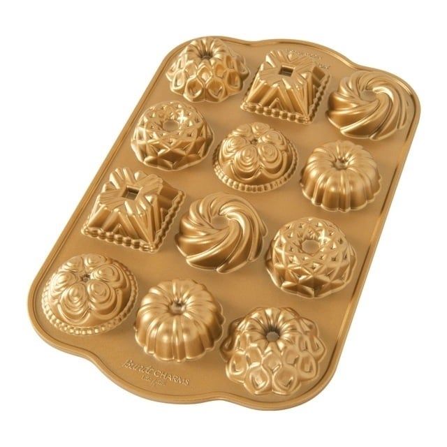 A baking tray featuring a variety of detailed molds for pastries or cakes