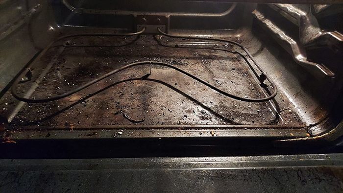 Reviewer's photo of a heavily greased oven bottom before using the product