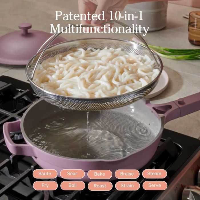 strainer lid over a pot on the stove, demonstrating its versatility for tasks like boiling and steaming