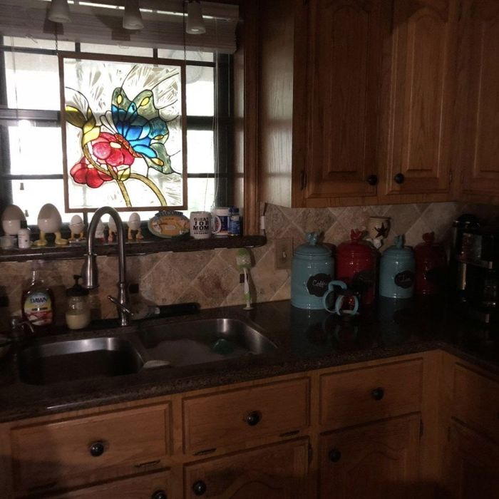 Reviewer’s kitchen before installing under-cabinet lights, completely dark and lacking visibility.