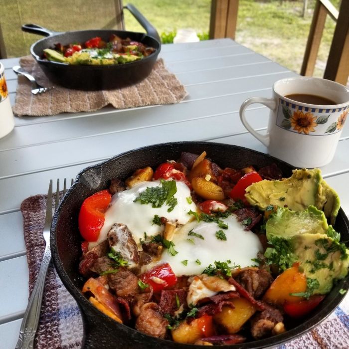 cast-iron skillet with a breakfast hash in it