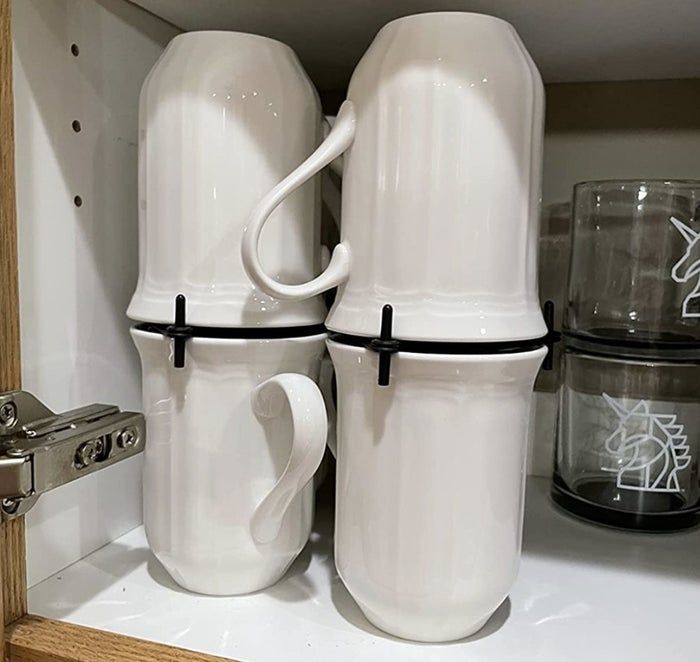 reviewer photo showing mug organizer with four mugs neatly arranged on their shelves