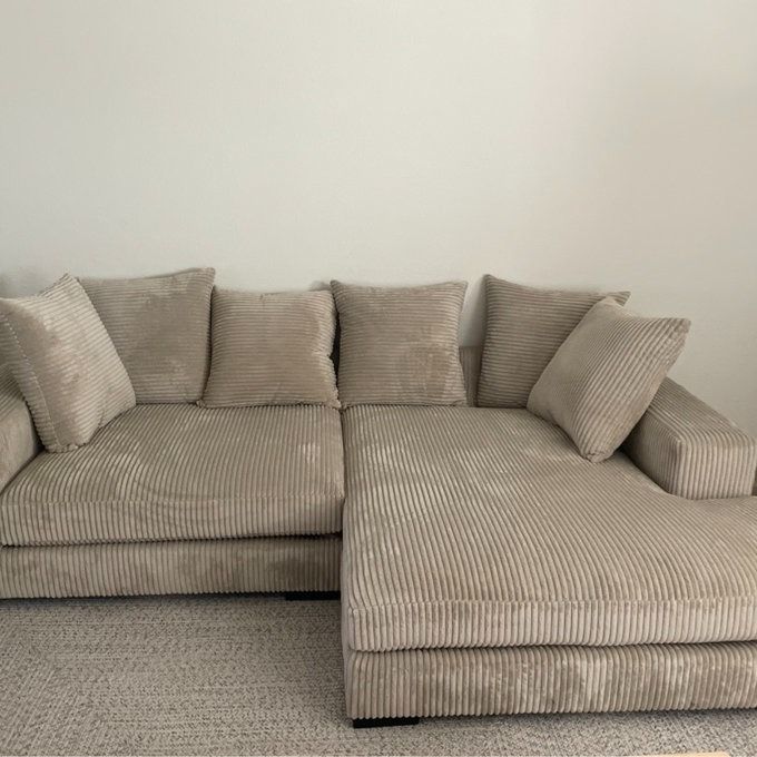a customer photo of the beige sectional sofa