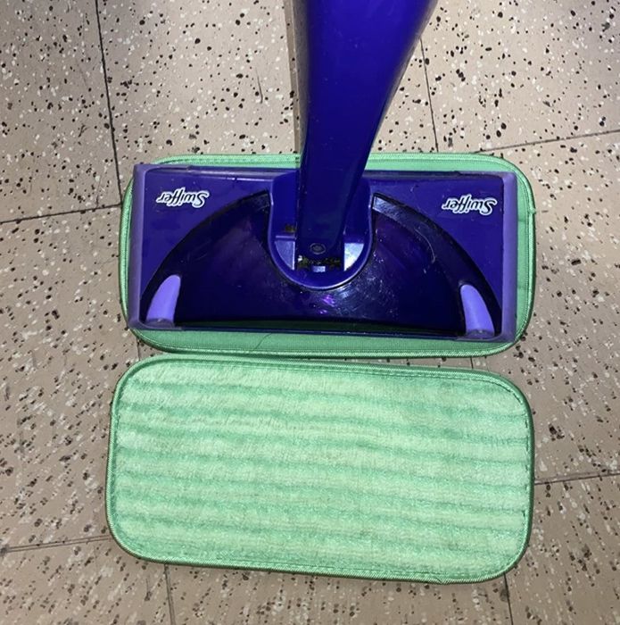 Reviewer photo showing the reusable mop pads in use with a Swiffer
