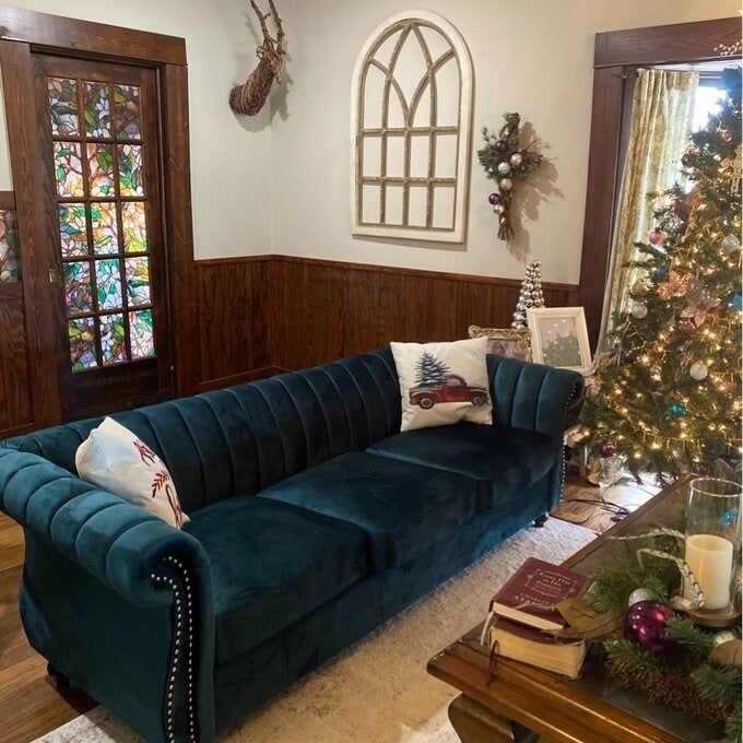 a customer photo of the teal sofa