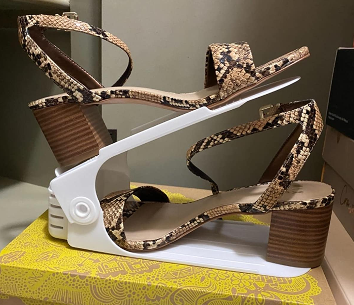 a reviewer photo of a pair of heels securely placed in the shoe stacker