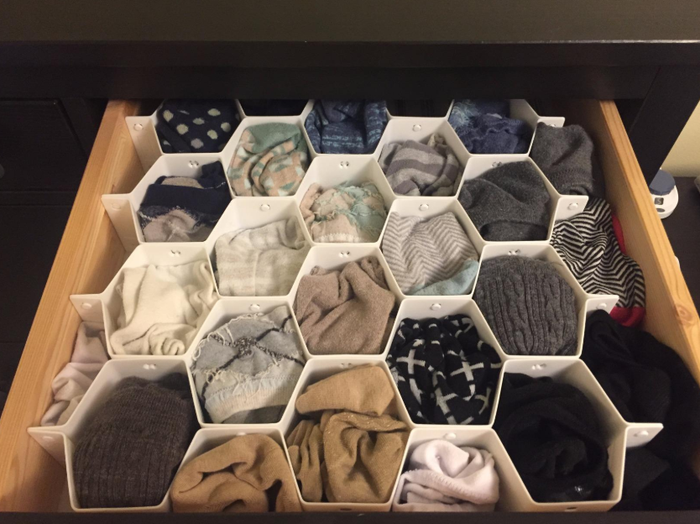 the same drawer now neatly arranged with each item in its designated cubby