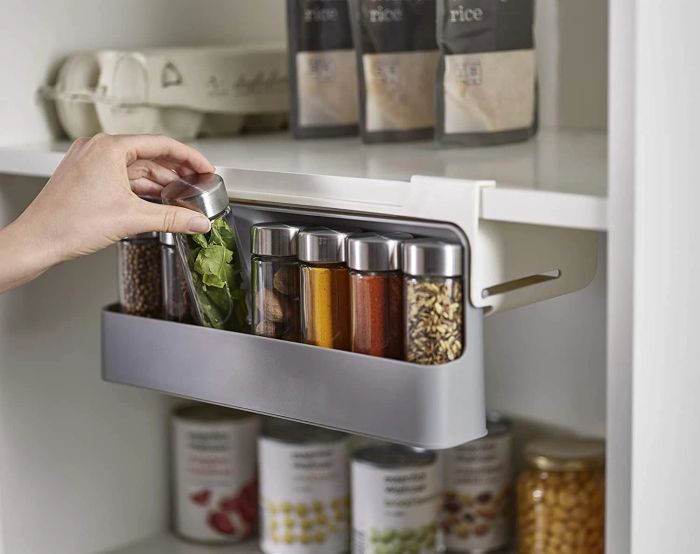 The spice shelf extended fully, revealing the neatly organized spices inside