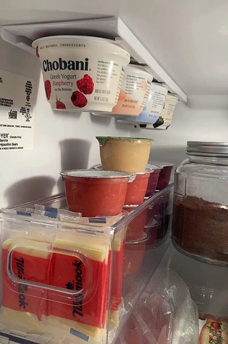 A reviewer's fridge featuring the organizer neatly holding Chobani yogurts