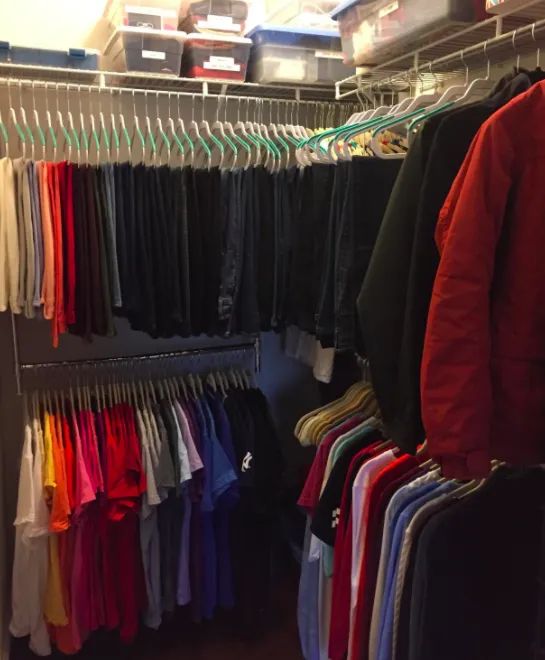 A customer review photo showing the Simple Houseware adjustable closet hanging rod in chrome, installed in their closet