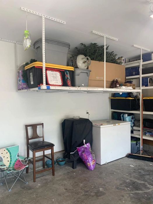 Reviewer image featuring the white storage rack set up in their garage.