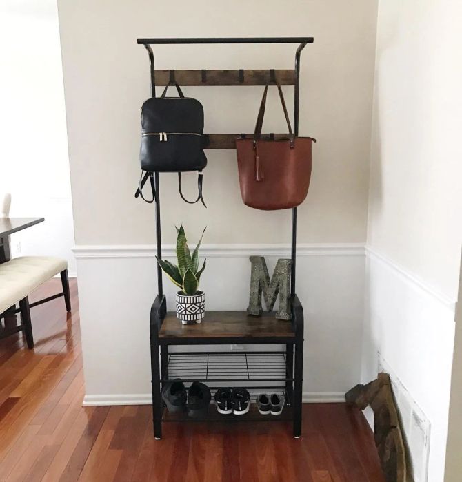 Reviewer photo showcasing the coat rack in use.